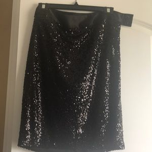 Beautiful sequined skirt with satin waist.